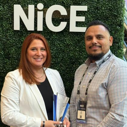 Amy Latzer and Jeff Zavala accepting NiCE CX excellence award