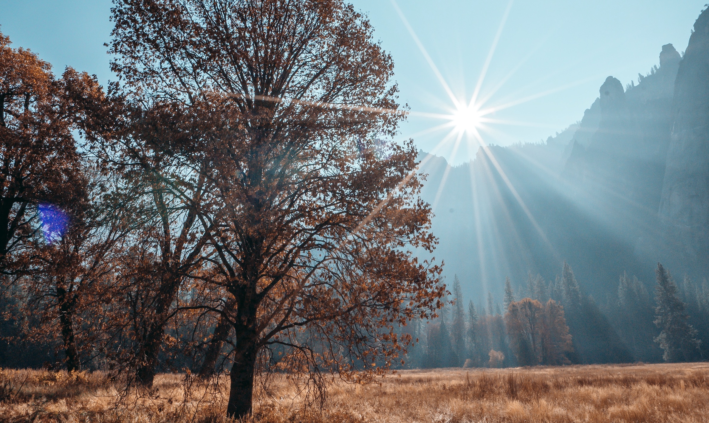 Yosemite Valley in Fall with Sun over mountains