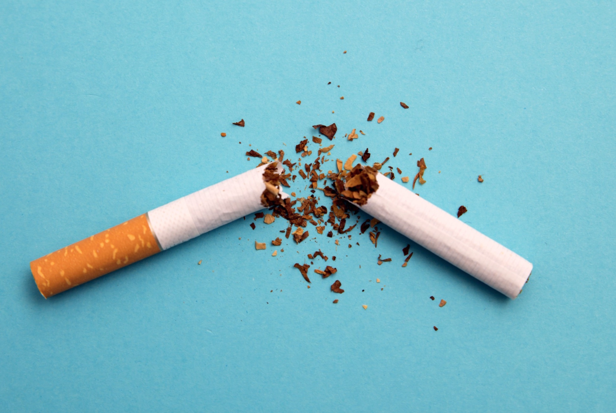 Broken Cigarette on Blue background