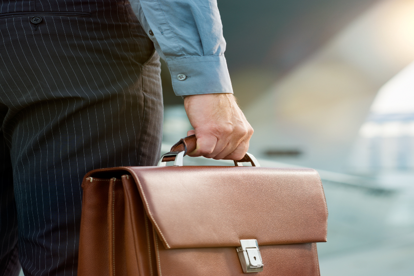 man with brief case in business attire