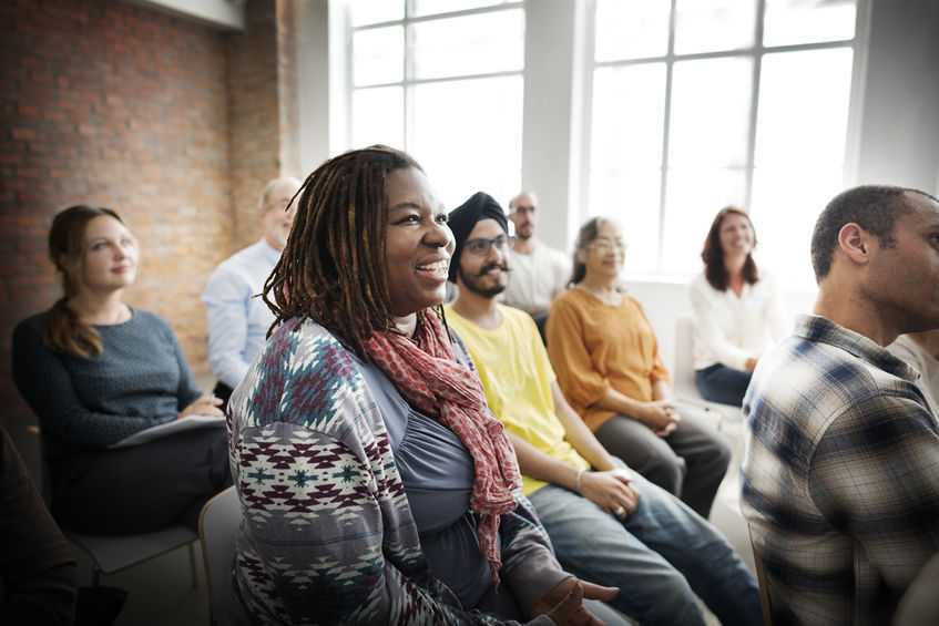 diver group of people sitting in a room