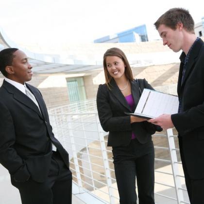 three young job seekers standing on a balcony