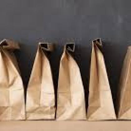 Brown lunch bag and apples