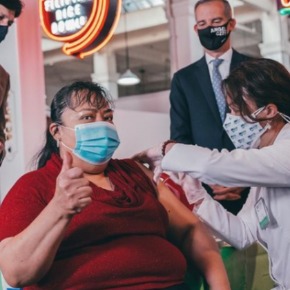 woman receiving vaccination at grand central market