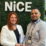 Amy Latzer and Jeff Zavala accepting NiCE CX excellence award